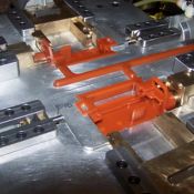 Molds are setup at injection machines and injected with orange wax.